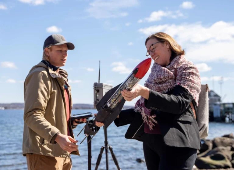 RWU Provost Margaret Everett is hands-on with Jaia Robotics’ engineer, Michael Rock